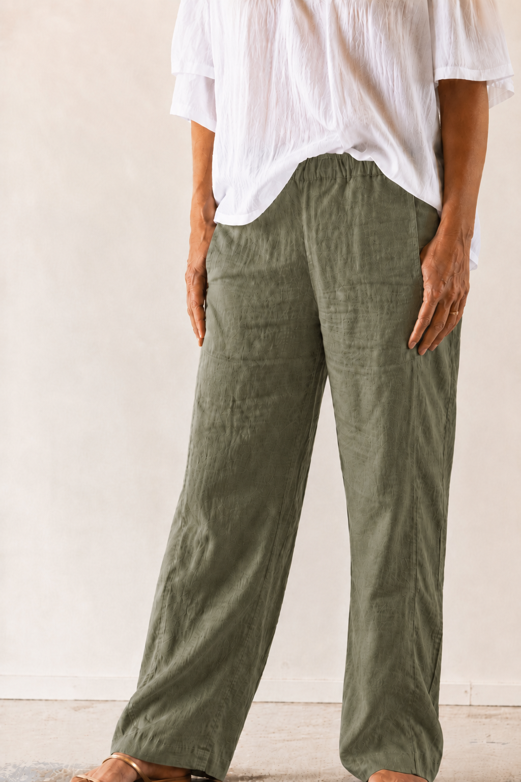 linen straight legged pant, side self stripe pockets in light army green.