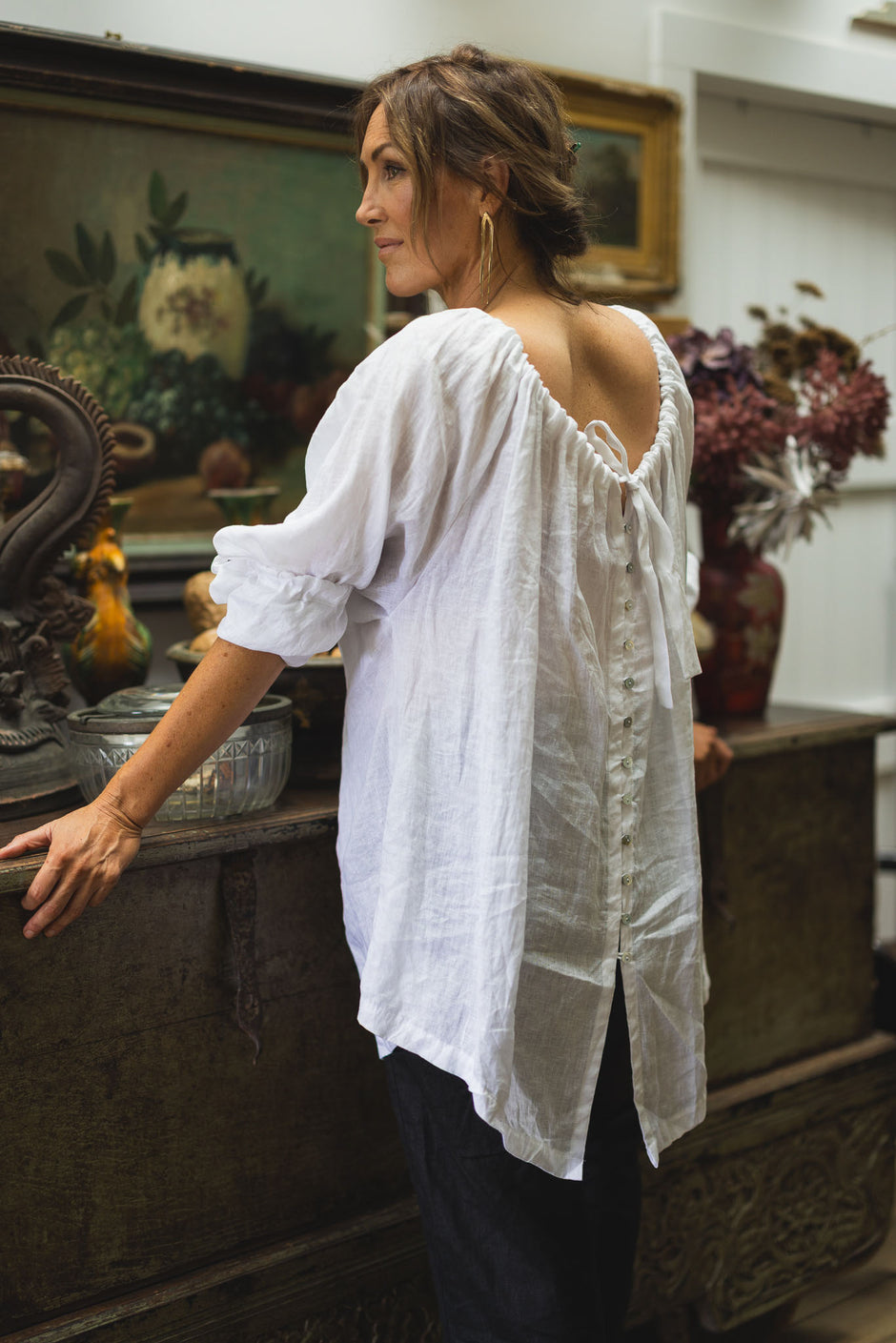 She;'s More Tied in white linen back detail