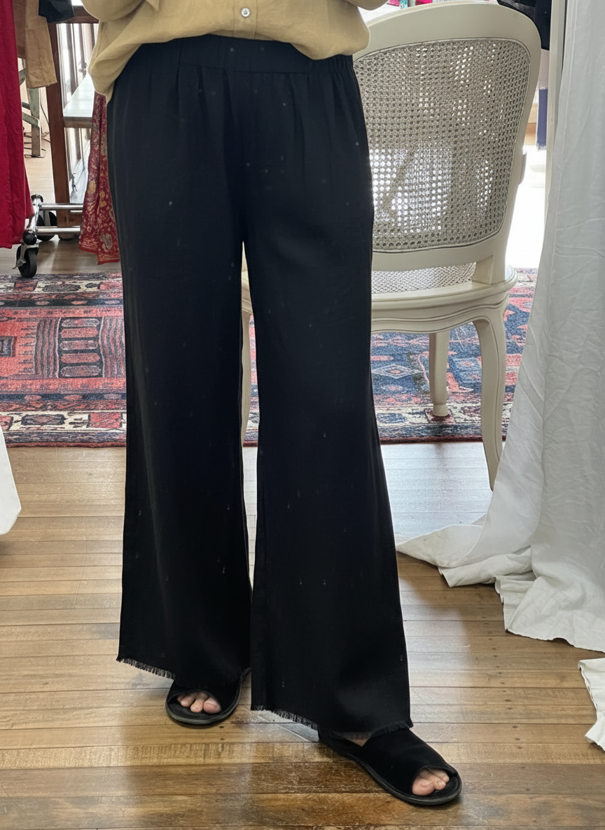 Beige shirt with black linen pants