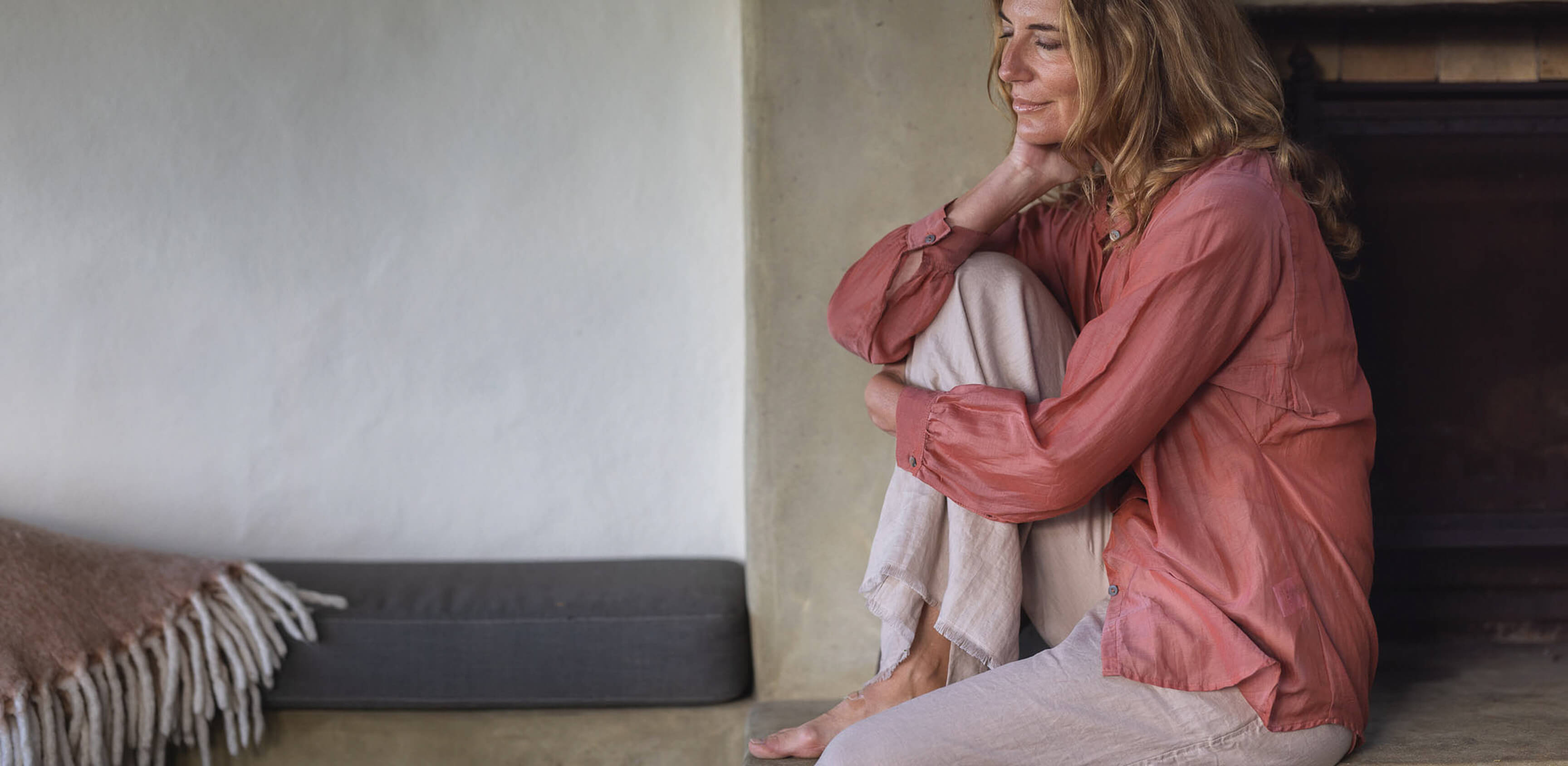 Women sitting in lounge wearing The Tailor and his Lover shirt and pants